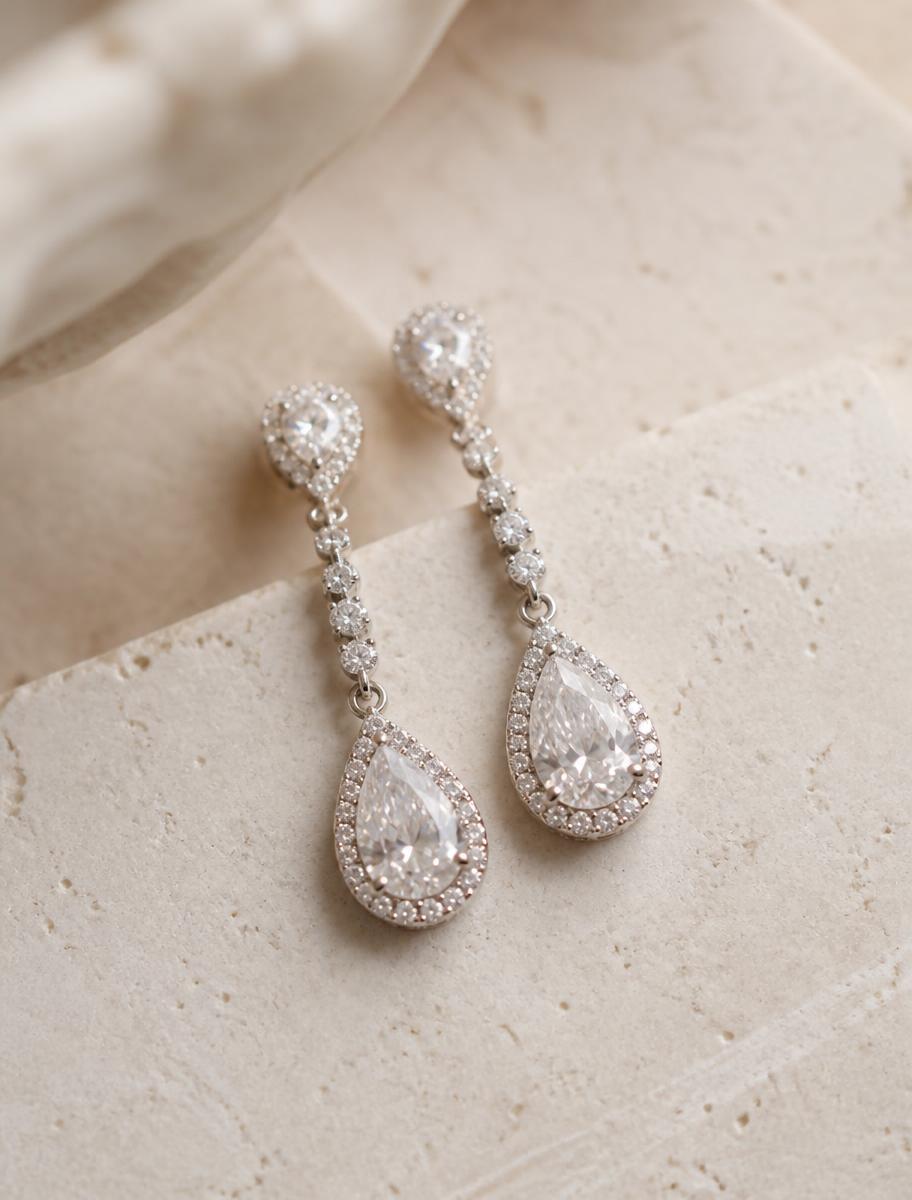 A pair of drop earrings drawn from a single sketch.
